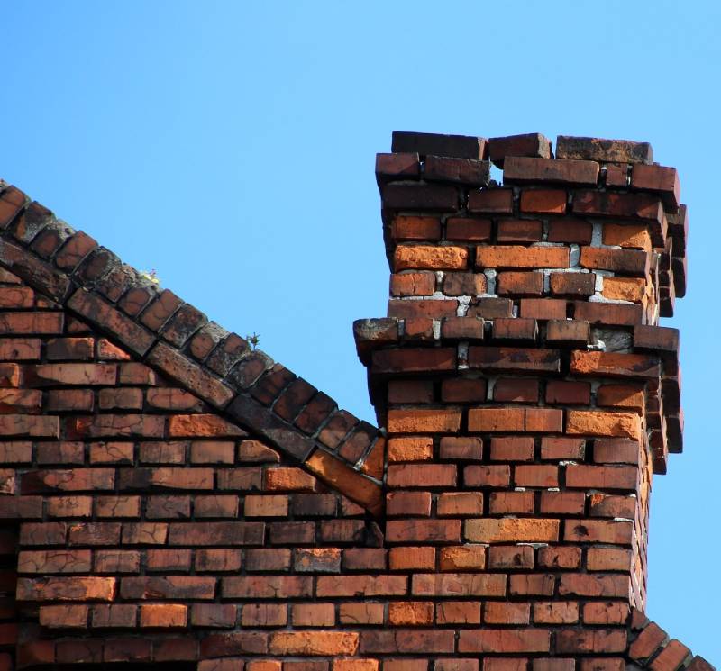 Signs Your Canton Home Needs a Chimney Inspection Damaged chimney on an Canton home showing cracks and missing mortar
